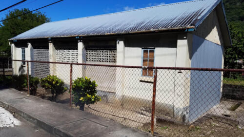 Small White Home Light Blue Roof