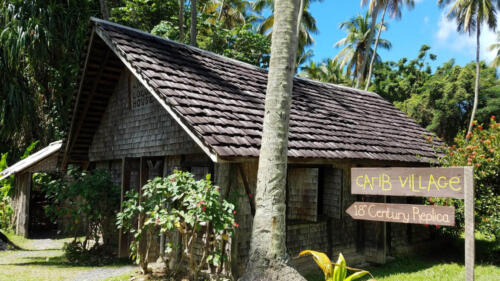 House with Carib Village Sign